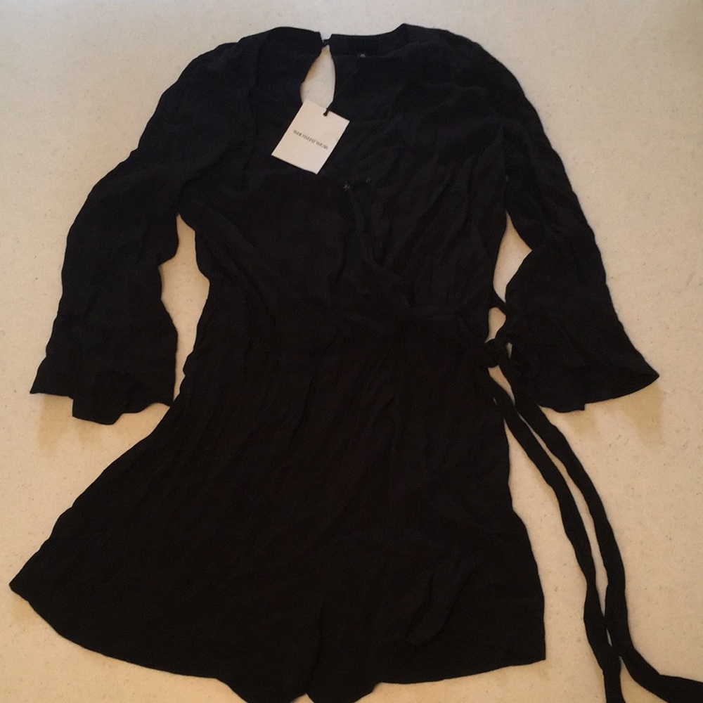 NWT Women’s faux wrap romper